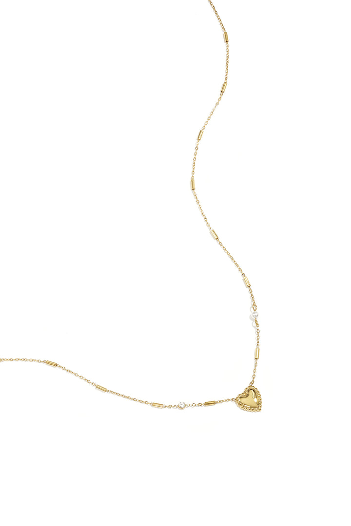 Ketting met parel, steentje en statement hart